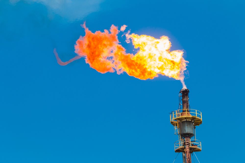 Excess methane is flared at an oil or gas production operation